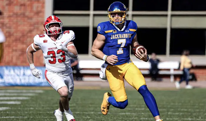 Football payer running with ball